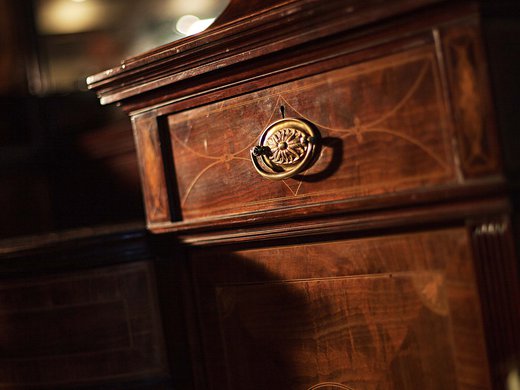 Hotel Böhlerstern: your conference hotel in Styria Antique wooden cabinet with floral inlay and brass handle