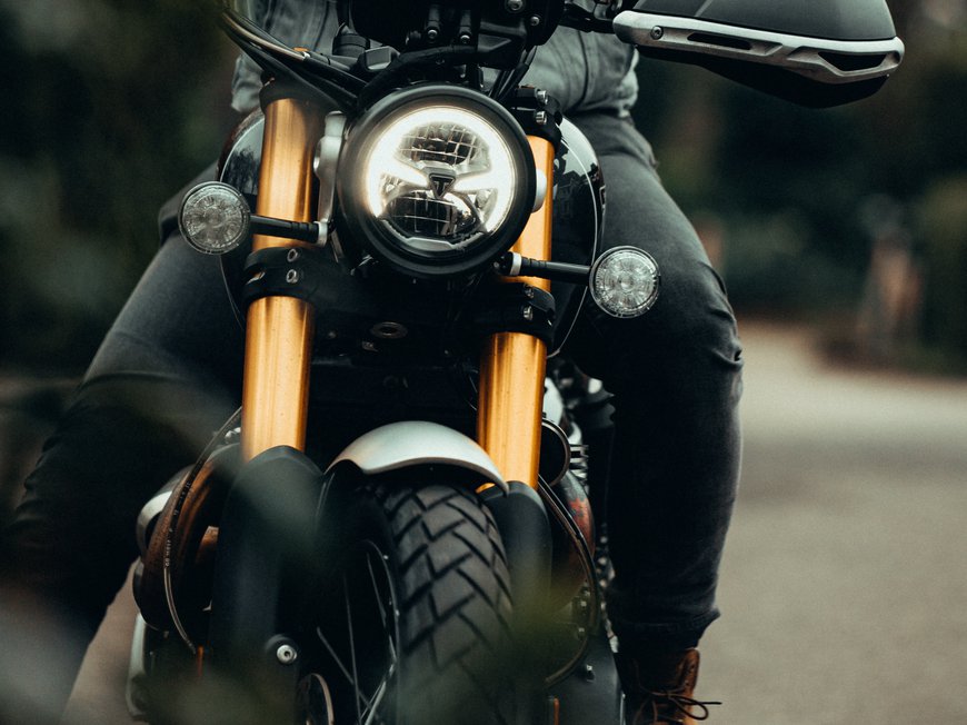 Hotel Böhlerstern: biker hotel in Styria Rider on motorcycle with illuminated headlight on country road